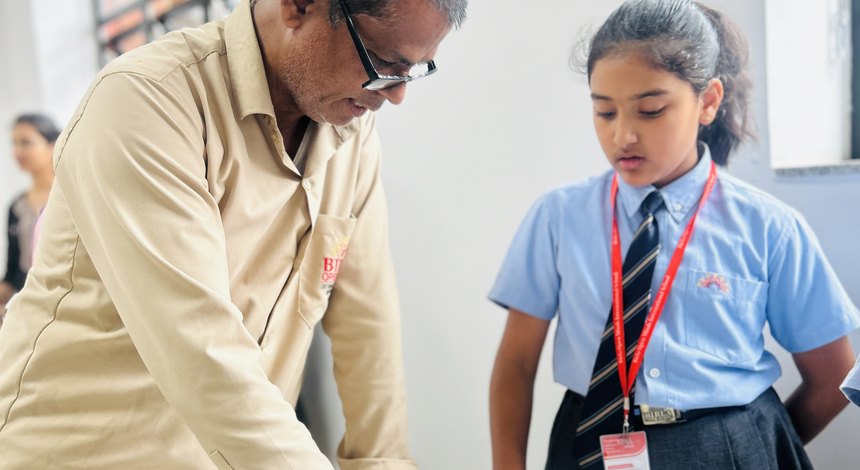 A hand guided to the right key at Birla Open Minds International School, Bhopal